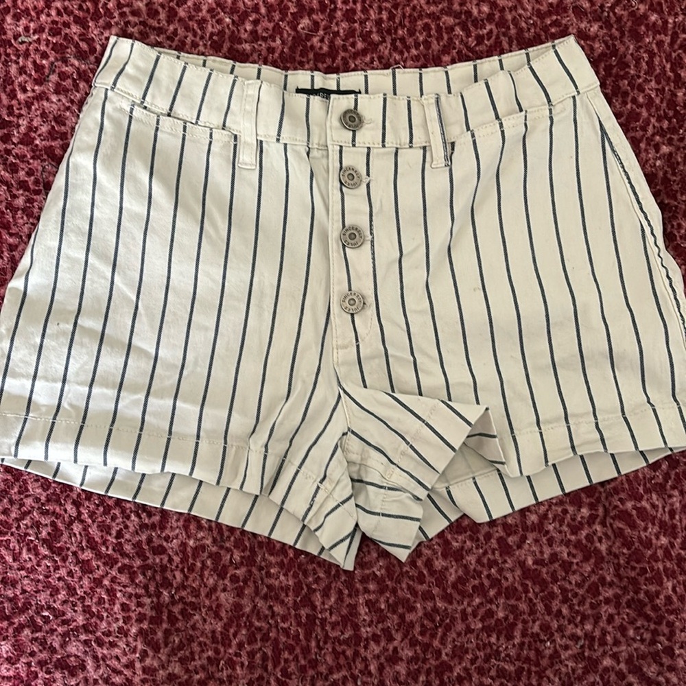 white shorts with blue stripes , size 9/29 Sincerely Jules